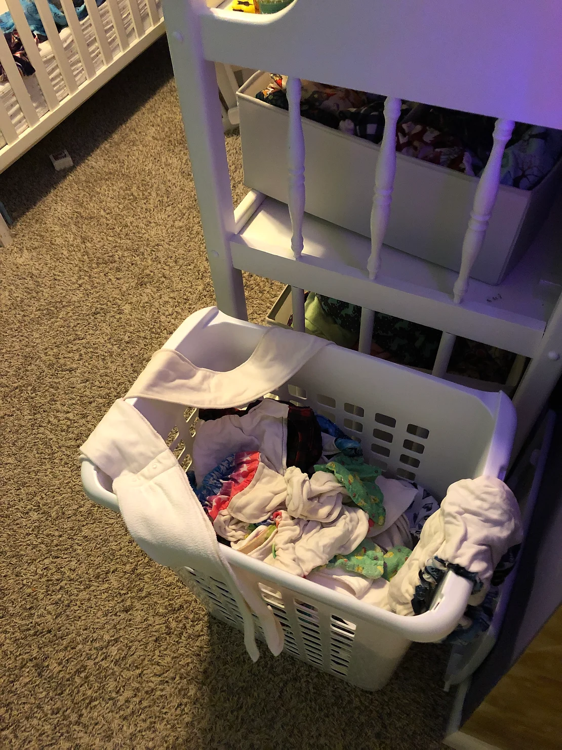 cloth diapers in laundry basket, ready to wash