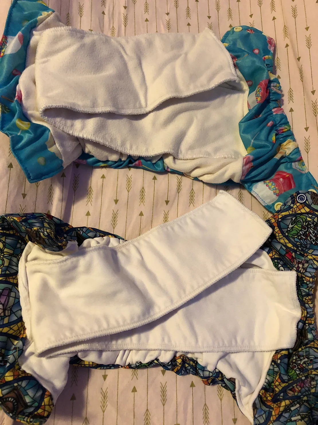 comparing two sizes of cloth diaper